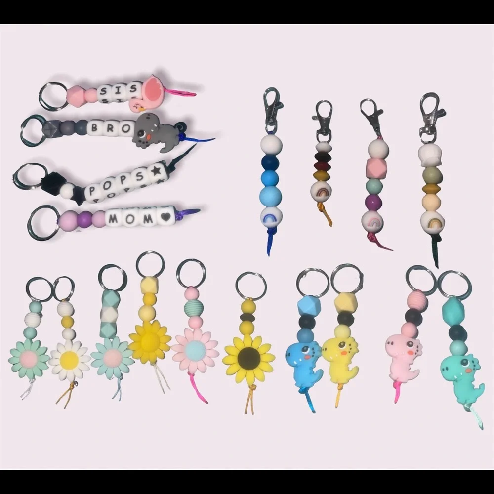 Custom keychain/zipper pulls I also make custom wristlets/pacifier clips, etc - Picture 1 of 2
